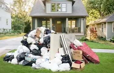 Pile of household junk on the lawn awaiting removal.