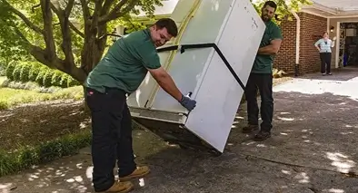 Refrigerator removal by employees of Tommy's Junk Removal  Fort Myers.
